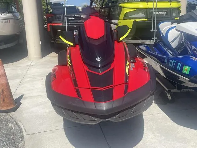 Slide: The Image of 2022 Yamaha WaveRunner FX Cruiser SVHO, red, with audio system, parked in a marina. - 4