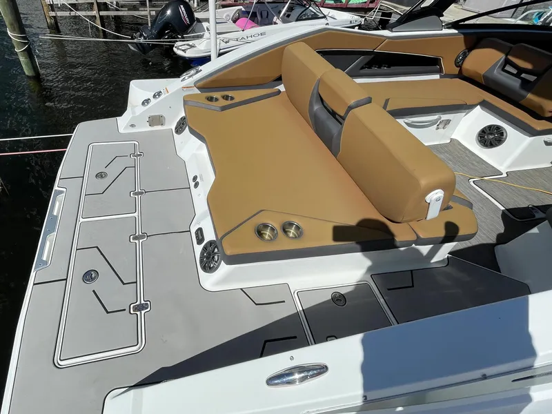 Slide: The Image of 2020 Scarab 285 ID boat with tan seating and spacious deck. - 10