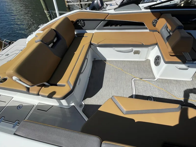 Slide: The Image of 2020 Scarab 285 ID boat interior with tan and gray seating. - 11