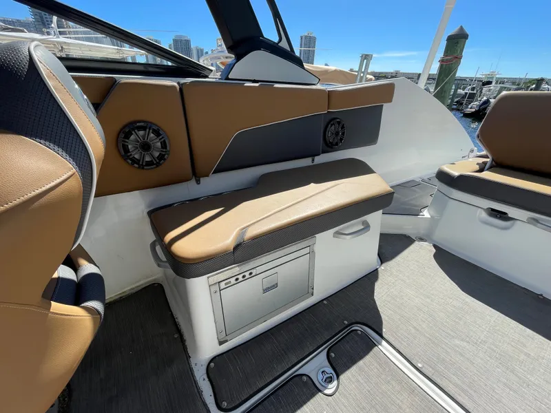 Slide: The Image of Interior of 2020 Scarab 285 ID boat with seating and storage. - 14