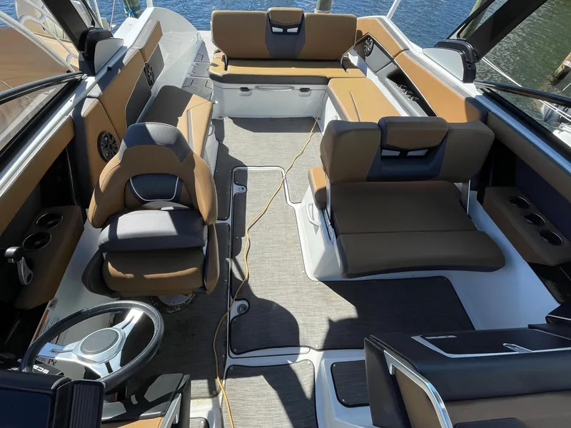 Slide: The Image of 2020 Scarab 285 ID boat interior with seating and steering wheel. - 17