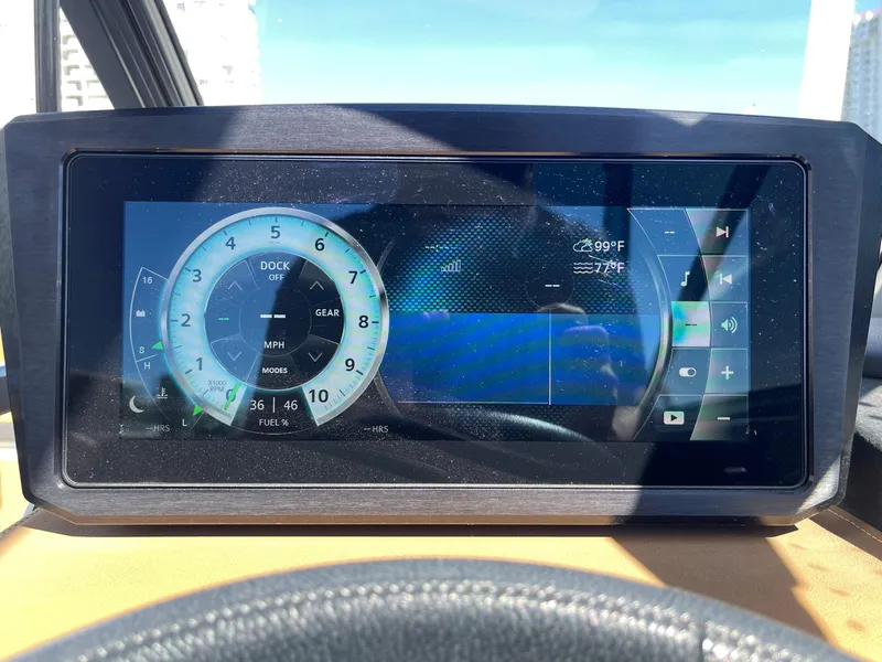 Slide: The Image of 2020 Scarab 285 ID dashboard display showing speedometer and controls. - 25