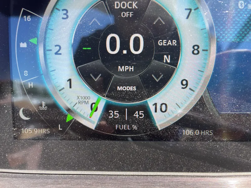 Slide: The Image of Close-up of 2020 Scarab 285 ID boat dashboard display showing 0.0 MPH and fuel percentage. - 26