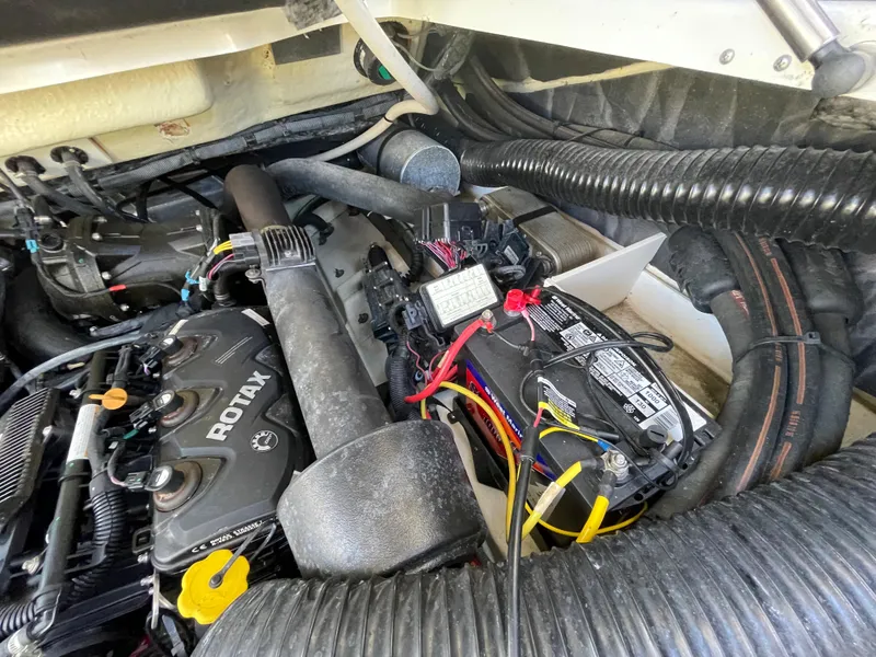 Slide: The Image of Engine compartment of a 2020 Scarab 285 ID boat showing Rotax engine and wiring. - 37