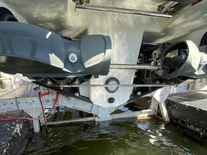 Slide: The Image of Close-up of the underside of a 2020 Scarab 285 ID boat on a lift. - 42