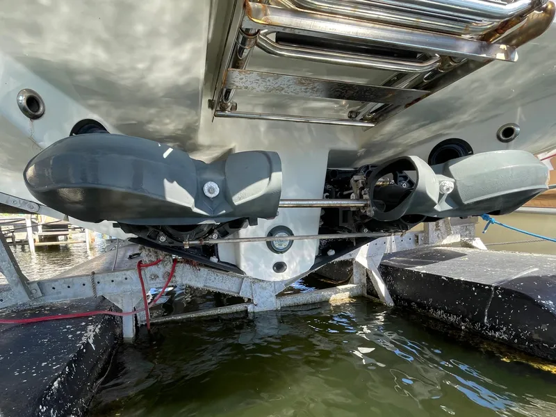 Slide: The Image of 2020 Scarab 285 ID boat's dual jet drives in a marina. - 43