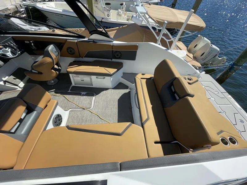 Slide: The Image of 2020 Scarab 285 ID boat interior with tan seating and modern design. - 8