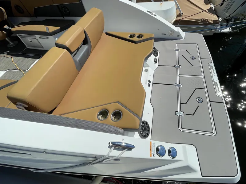 Slide: The Image of 2020 Scarab 285 ID boat with tan seating and gray deck. - 9