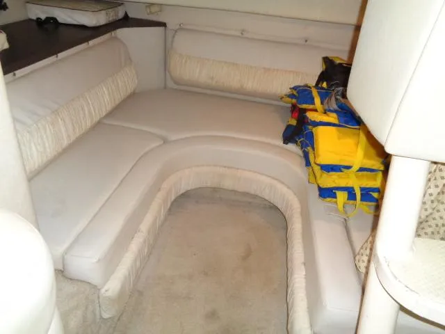 Slide: The Image of Interior cabin of a 1997 Regal 292 Commodore boat with seating and life jackets. - 19