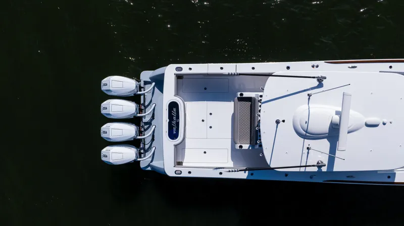 Slide: The Image of 2025 Valhalla Boatworks V-41, aerial view, showcasing triple outboard engines on calm water. - 11