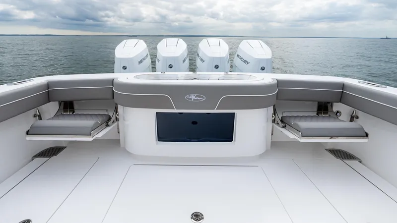 Slide: The Image of 2025 Valhalla Boatworks V-41 with quad engines, spacious deck, and seating, on open water. - 15