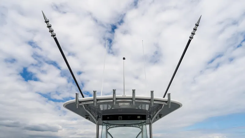 Slide: The Image of 2025 Valhalla Boatworks V-41 with outriggers against a cloudy sky. - 19