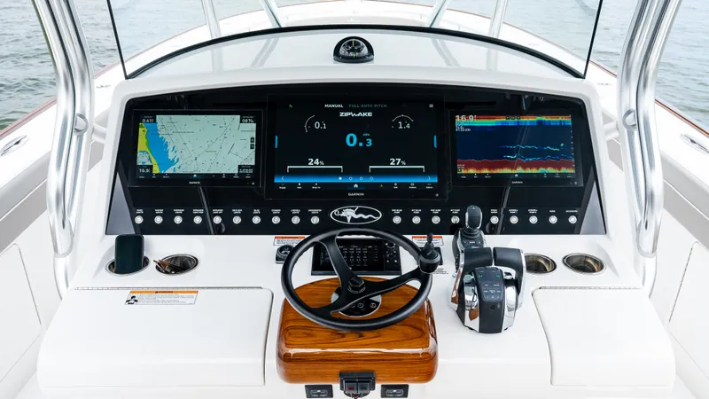 Slide: The Image of 2025 Valhalla Boatworks V-41 helm with advanced navigation displays and controls. - 30