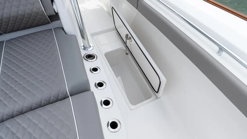 Slide: The Image of 2025 Valhalla Boatworks V-41 interior with gray quilted seating and storage compartment. - 36