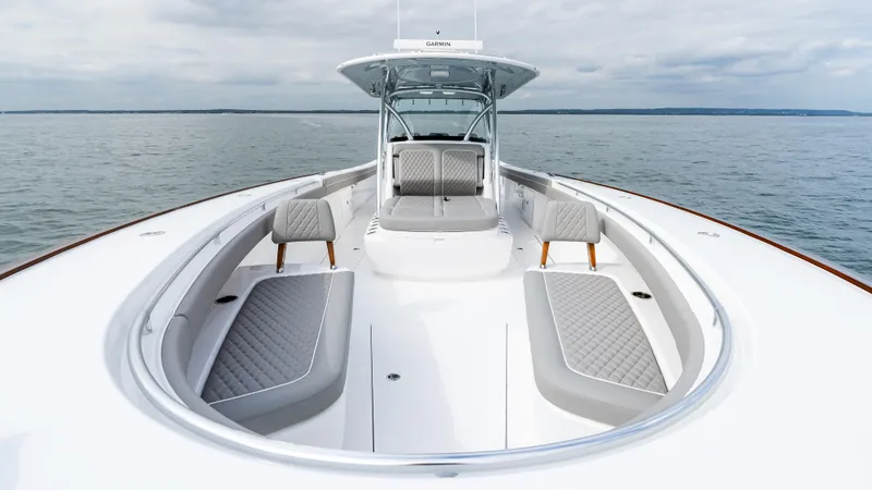 Slide: The Image of 2025 Valhalla Boatworks V-41 on calm water, showcasing sleek design and spacious seating. - 46