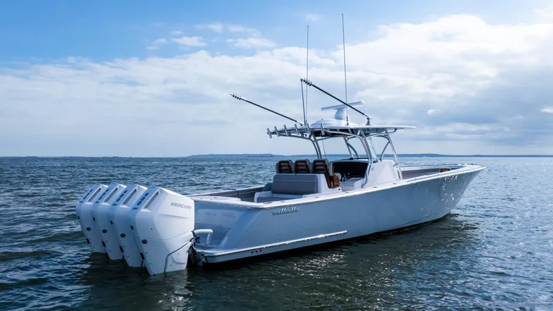 Slide: The Image of 2025 Valhalla Boatworks V-41 on open water, featuring multiple outboard engines. - 6