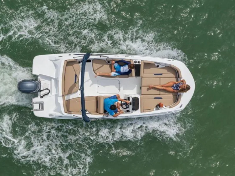 Slide: The Image of Aerial view of 2024 Hurricane SunDeck Sport 185 OB boat cruising on water. - 1