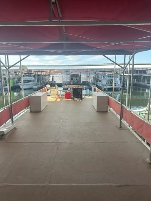 Slide: The Image of 1978 Kayot houseboat deck with canopy, docked at marina. - 19