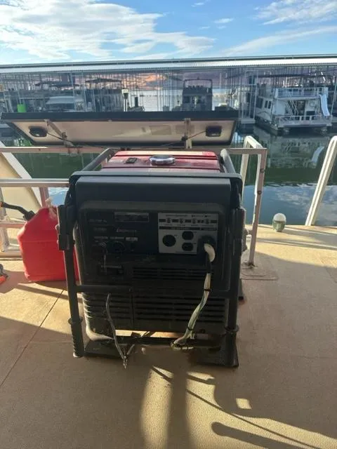 Slide: The Image of 1978 Kayot houseboat deck with a portable generator and fuel container. - 20