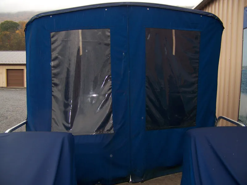 Slide: The Image of 2005 Sun Tracker Party Barge with blue canopy. - 4