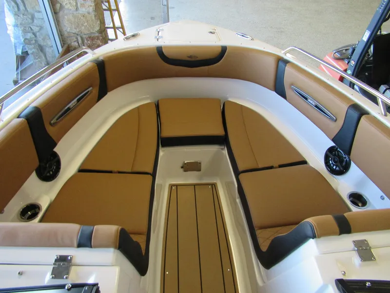 Slide: The Image of 2024 Chaparral 247 SSX boat interior with tan and black seating. - 5