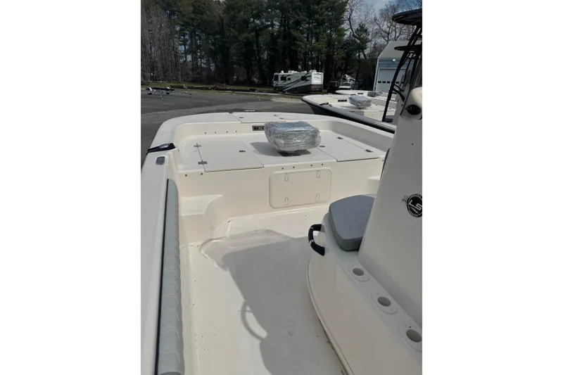 Slide: The Image of 2026 Carolina Skiff 21 LS boat interior with seating and storage compartments. - 10