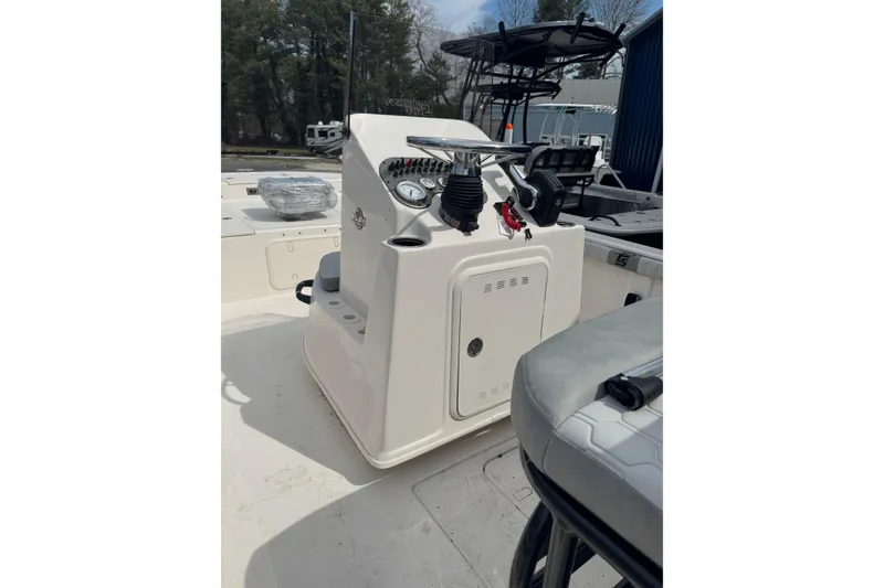 Slide: The Image of 2026 Carolina Skiff 21 LS boat interior with steering console and seating. - 5