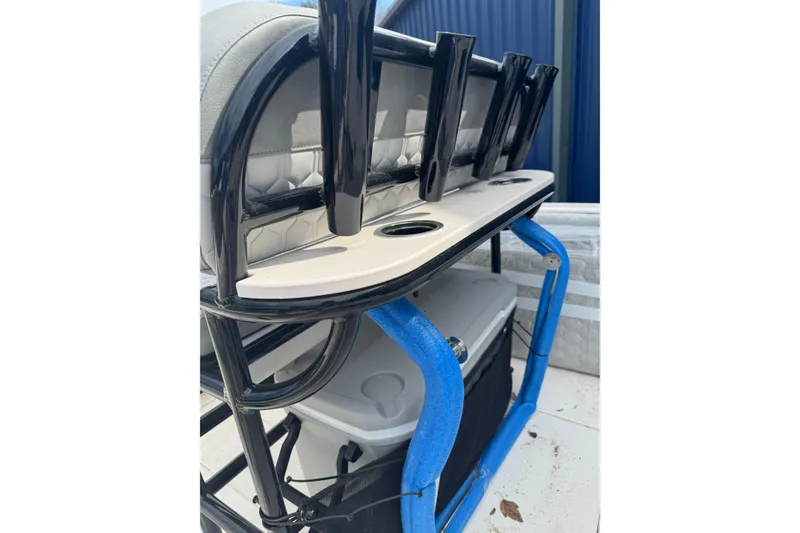Slide: The Image of 2026 Carolina Skiff 21 LS boat seat with rod holders and storage. - 6