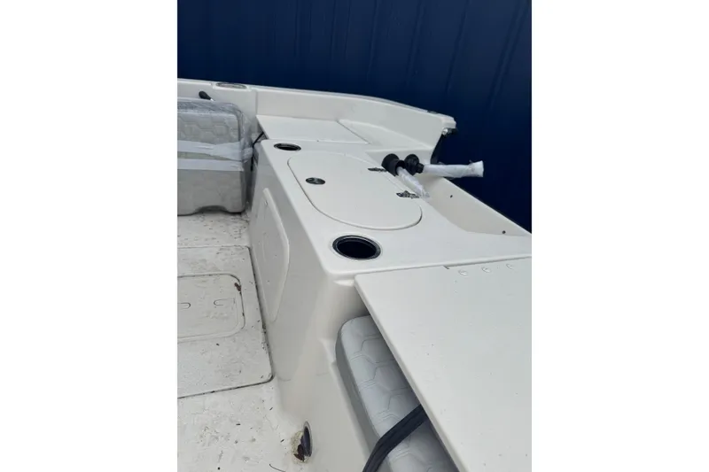 Slide: The Image of 2026 Carolina Skiff 21 LS boat interior with seating and storage compartments. - 7
