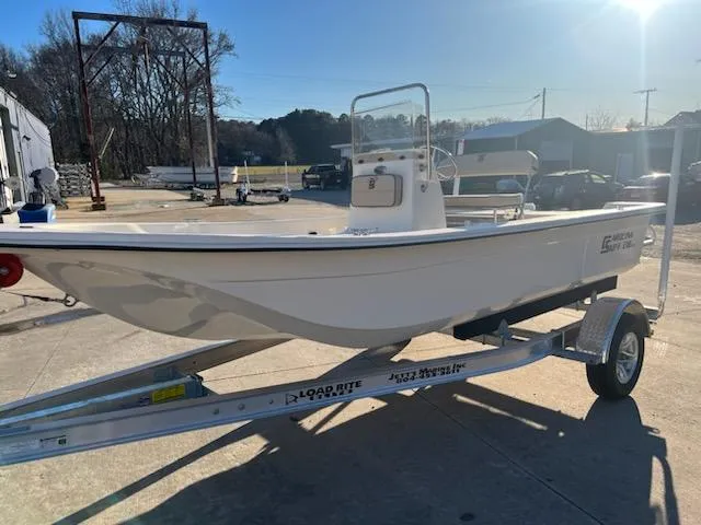 The Image of 2025 Carolina Skiff E18 CC boat on trailer in sunny outdoor setting. - 2