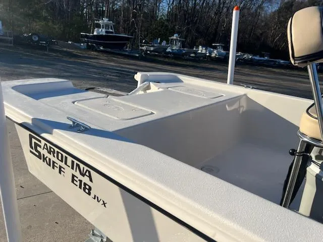 Slide: The Image of 2025 Carolina Skiff E18 CC boat, white deck, outdoor setting. - 4