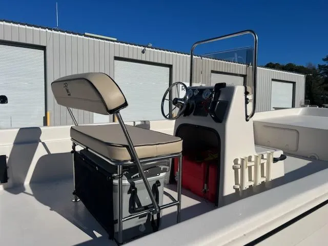 Slide: The Image of 2025 Carolina Skiff E24DLX CC boat interior with console and seating. - 4