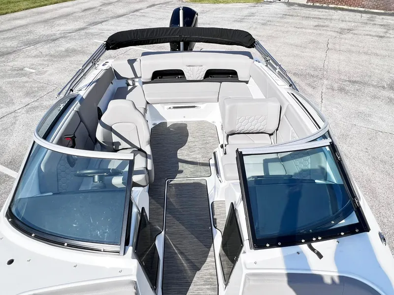 Slide: The Image of 2023 Four Winns H1 OB boat interior with open bow seating and modern design. - 11