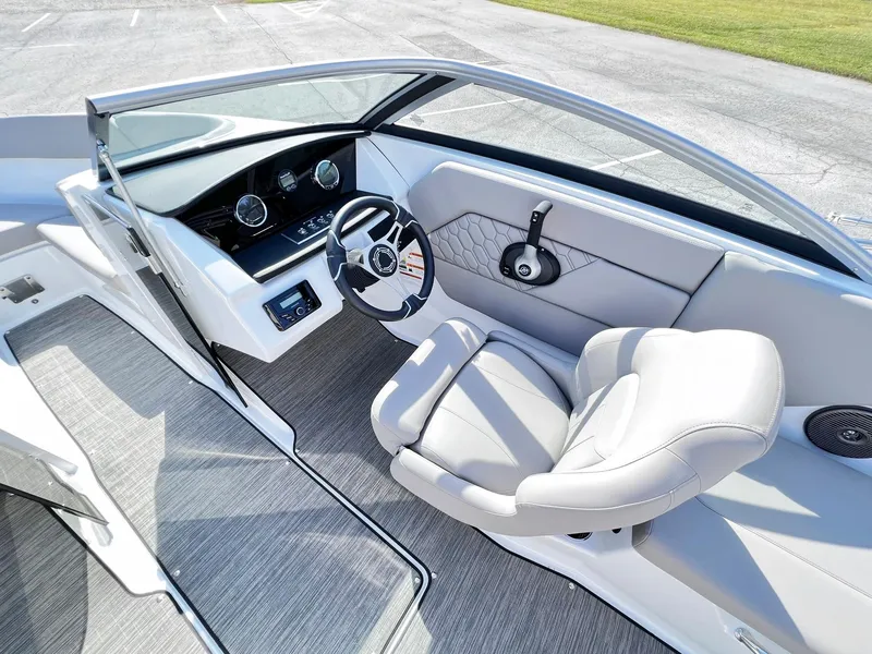 Slide: The Image of 2023 Four Winns H1 OB boat interior with modern helm and comfortable seating. - 18