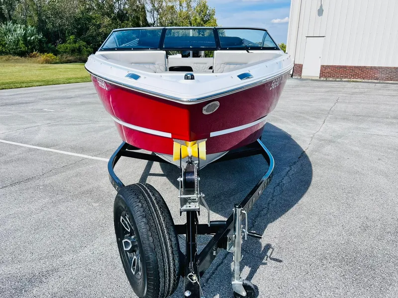 Slide: The Image of 2023 Four Winns H1 OB boat on a trailer, front view. - 2