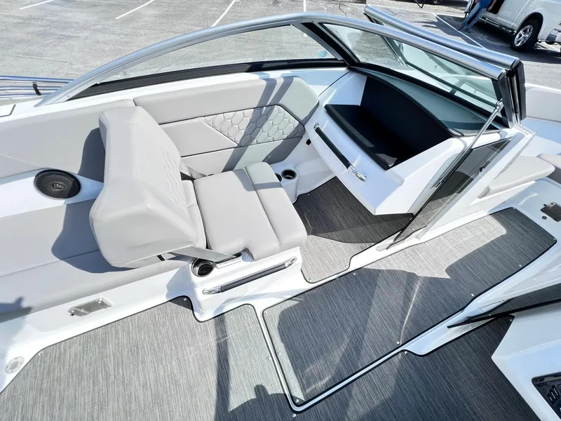 Slide: The Image of 2023 Four Winns H1 OB boat interior with gray seating and modern design. - 21