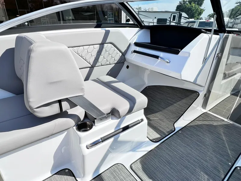 Slide: The Image of 2023 Four Winns H1 OB boat interior with modern seating and dashboard. - 22