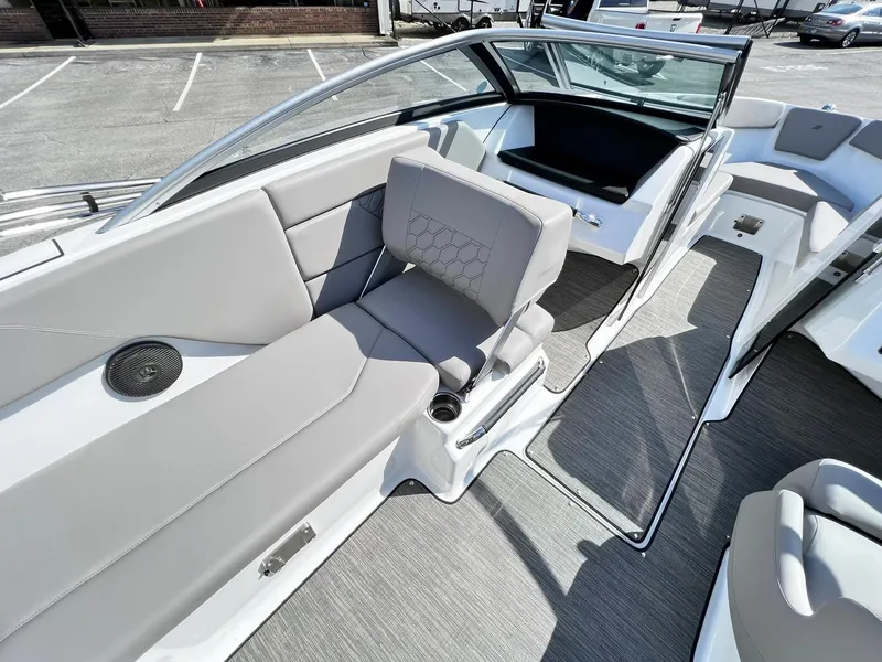Slide: The Image of 2023 Four Winns H1 OB boat interior with gray seating and modern design. - 23
