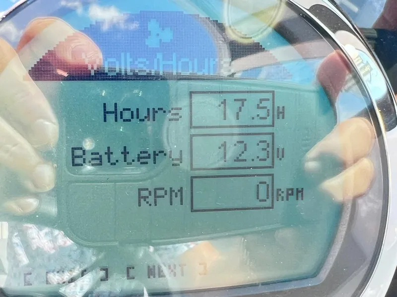Slide: The Image of Digital display of 2023 Four Winns H1 OB showing 17.5 hours, 12.3V battery, 0 RPM. - 26