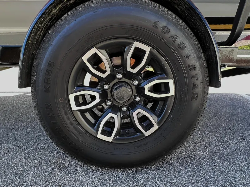Slide: The Image of 2023 Four Winns H1 OB trailer wheel with Load Star tire. - 28