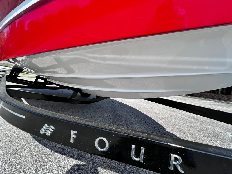 Slide: The Image of 2023 Four Winns H1 OB boat on trailer, close-up view. - 3