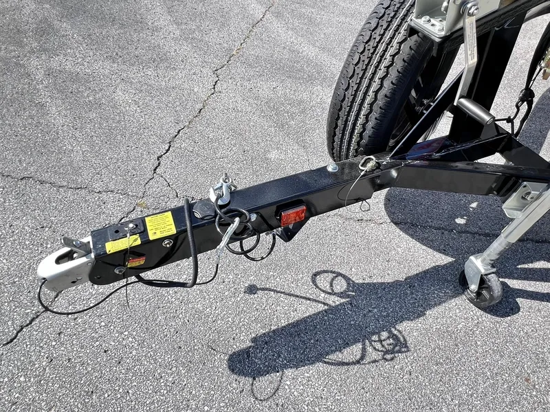 Slide: The Image of Trailer hitch of 2023 Four Winns H1 OB boat on asphalt surface. - 32