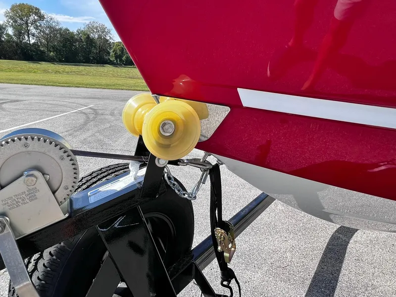 Slide: The Image of 2023 Four Winns H1 OB boat on trailer with yellow rollers. - 33