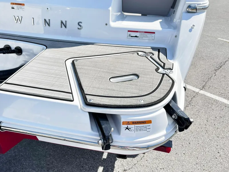 Slide: The Image of 2023 Four Winns H1 OB boat swim platform with fold-out ladder. - 34