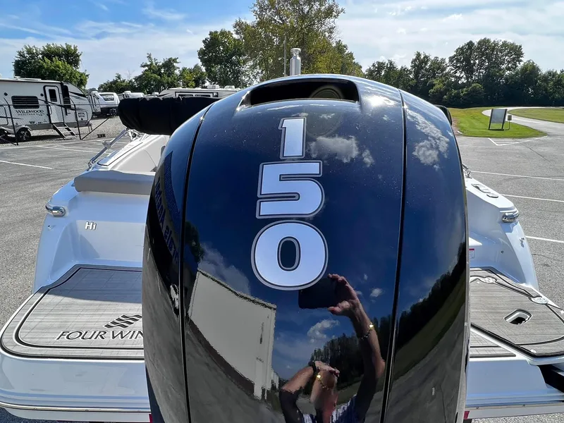 Slide: The Image of 2023 Four Winns H1 OB boat with 150 horsepower outboard motor. - 36