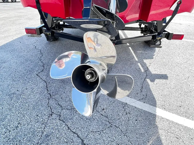 Slide: The Image of 2023 Four Winns H1 OB boat propeller and trailer on asphalt. - 37