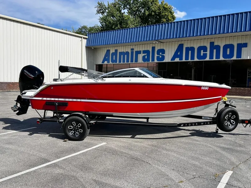 Slide: The Image of 2023 Four Winns H1 OB boat in red on a trailer outside Admirals Anchor. - 9