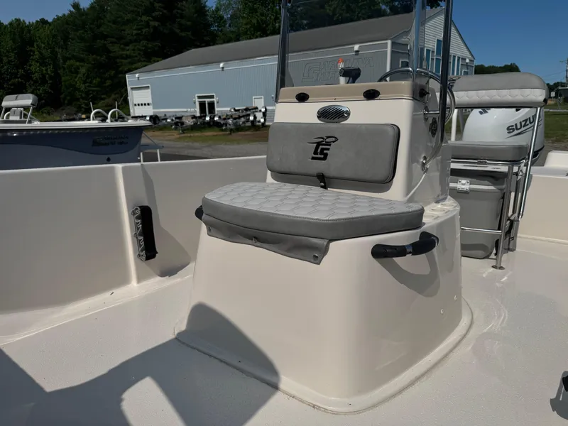 Slide: The Image of 2025 Carolina Skiff 192 JLS boat interior with cushioned seating and console. - 7