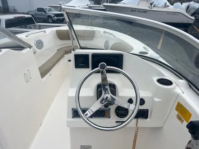 Slide: The Image of 2020 Key West 203 DFS boat interior with steering wheel and dashboard. - 11