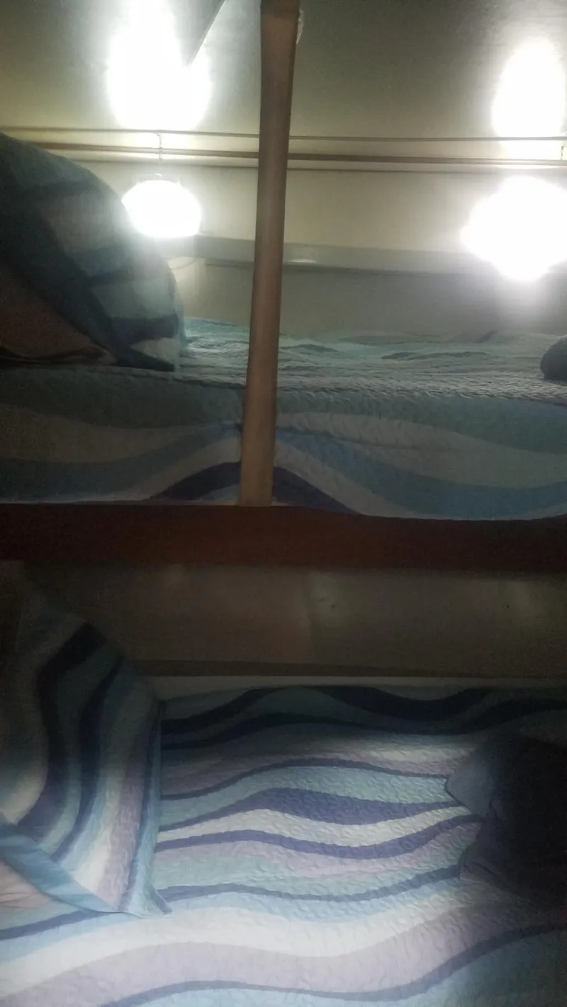 Slide: The Image of Bunk beds in the 1974 Stephens 68 Motor Yacht cabin. - 17